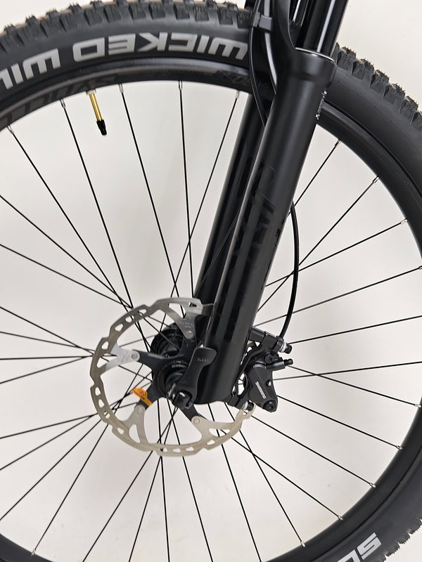 Trek Top Fuel 9.7 2022 CARBON bike shot in the urban environment showcasing its versatile usage.