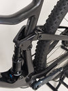Action shot of the Scott Spark RC 900 Team Issue AXS Carbon bike in motion on a trail.