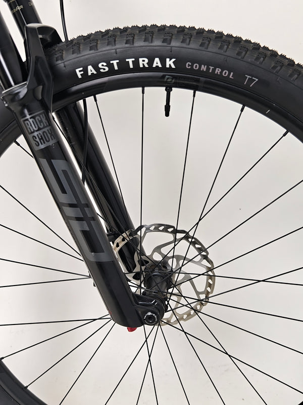 Aerial view of Scott Spark RC 900 Team Issue AXS Carbon bike in a vibrant landscape.