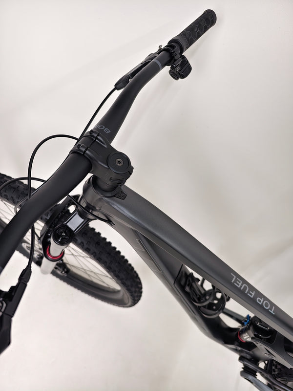 Trek Top Fuel 8 GX AXS 2024 showcasing the bike in an outdoor setting for optimal viewing.