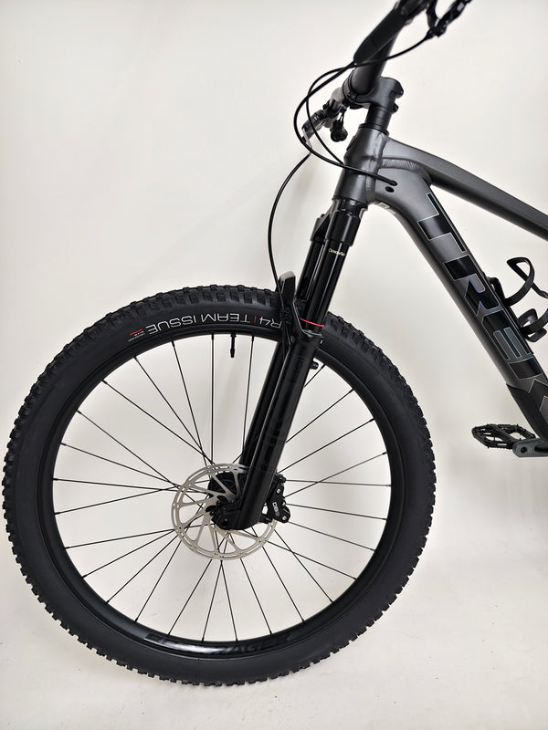 Trek Top Fuel 8 GX AXS 2024 captured during a test ride, showcasing its performance and agility.