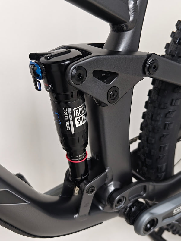 Trek Top Fuel 8 GX AXS 2024 viewed at an angle to emphasize its suspension system and travel specs.