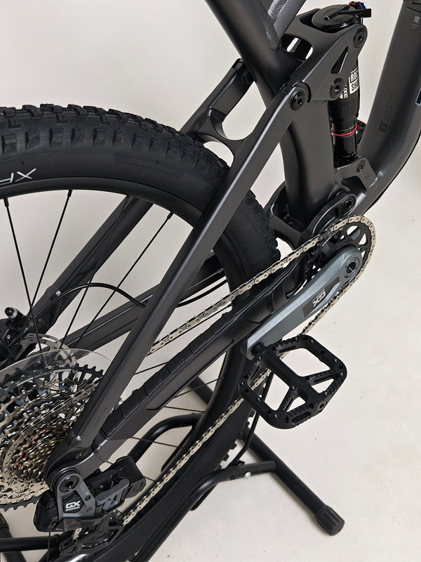 Trek Top Fuel 8 GX AXS 2024 showcasing the suspension at rest for a full side profile.