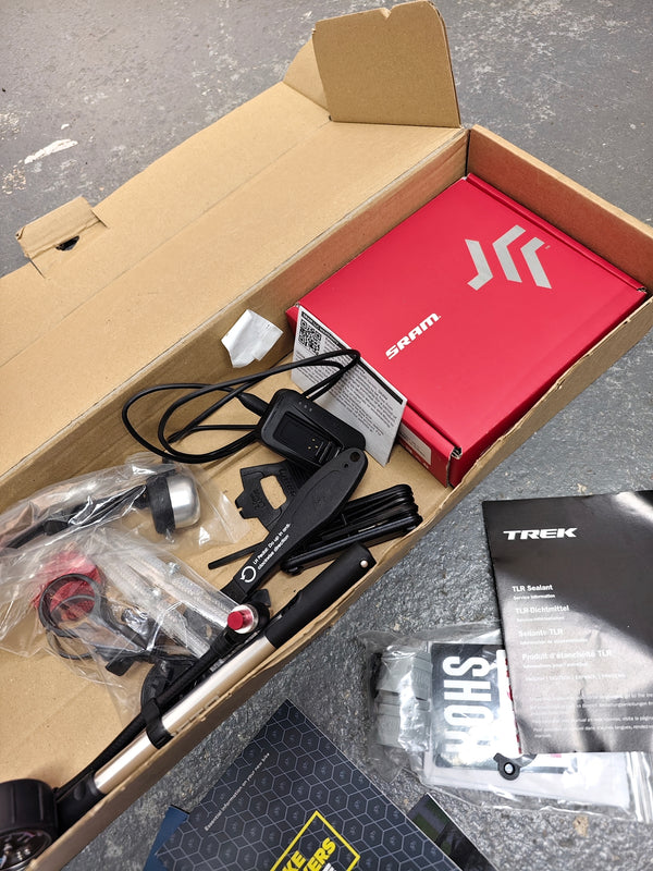 Trek Top Fuel 8 GX AXS 2024 demonstrating stability and agility on variable trail conditions.