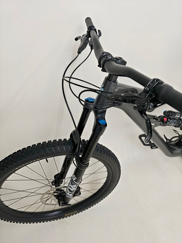 A detailed photo of the SRAM Code R brakes on the Specialized Status 160, emphasizing stopping power.