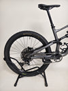 A prominent view of the Specialized Status 160 mountain bike, focusing on design and features.