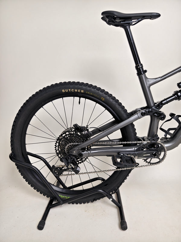 A prominent view of the Specialized Status 160 mountain bike, focusing on design and features.