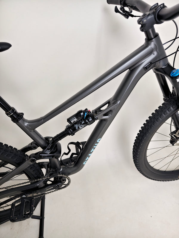 The rear suspension setup on the Specialized Status 160 mountain bike, showcasing its FOX shock performance.