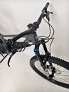 The Specialized Status 160 in action, showcasing the bike's capabilities on challenging terrain.