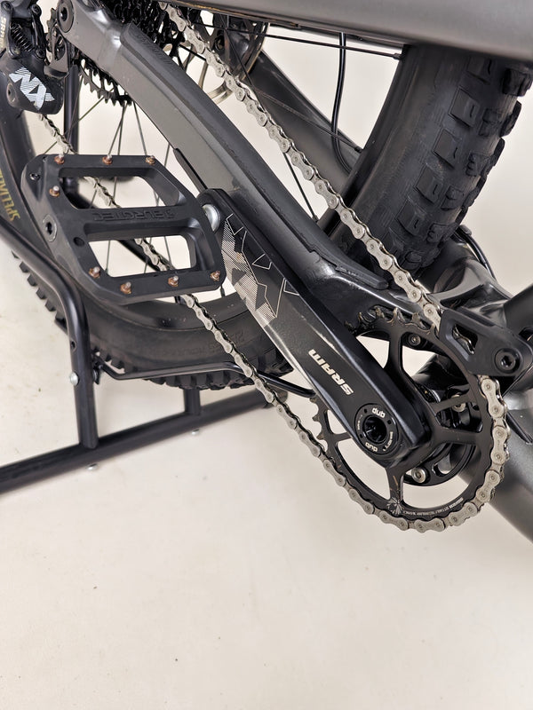 Wide shot of the Specialized Status 160 displayed with the natural landscape in the background.