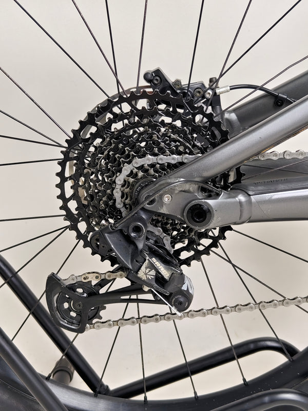 The powerful design of the Specialized Status 160 mountain bike, emphasizing its ride quality.