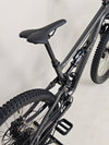 Detail of the rear triangle on the Specialized Status 160 mountain bike, showcasing its structural integrity.