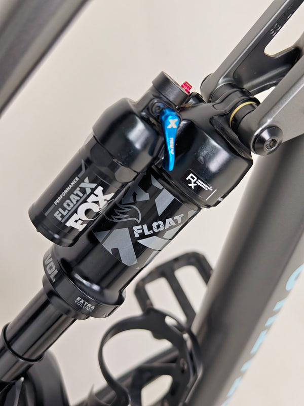 Full view of the Specialized Status 160 mountain bike from an angle providing perspective of its size.