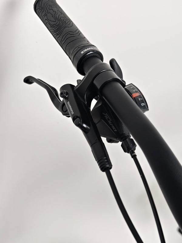 Image demonstrating the Specialized Turbo Tero 3.0 in action on a steep descent, showcasing stability.