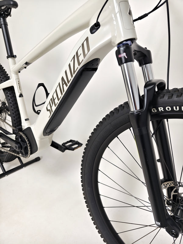 Full view of the Specialized Turbo Tero 3.0 Electric MTB parked in a recreational area, showcasing its robust design.