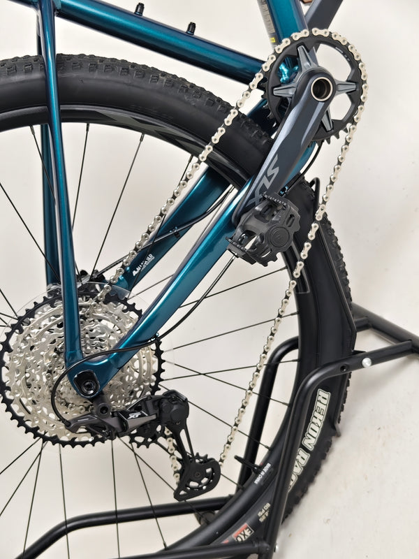 Giant XTC SLR 29 1 Mountain Bike 2024 with a backdrop emphasizing its ruggedness.