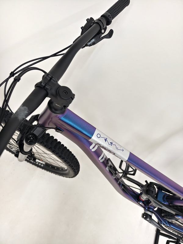 Dynamic view of the Voodoo CANZO Pro 2026 LARGE Dropper bike in action, demonstrating its agility and pristine condition.