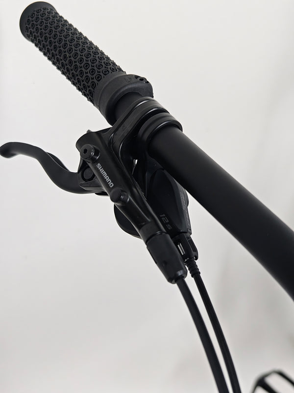 Side angle of the Voodoo CANZO Pro 2026 LARGE Dropper bike, showing the quality craftsmanship and pristine finishing, indicating Like NEW state.