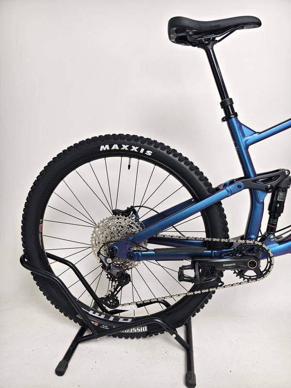 Voodoo CANZO Pro 2026 LARGE Dropper bike showcased in a nature backdrop, emphasizing its versatility and Like NEW condition.