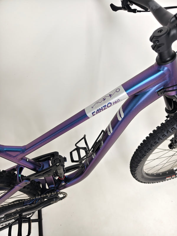 Voodoo CANZO Pro 2026 LARGE Dropper bike during a ride, illustrating its performance features and maintaining a Like NEW quality appearance.