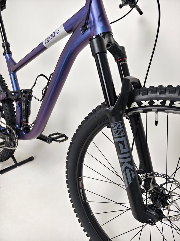 Voodoo CANZO Pro 2026 LARGE Dropper bike captured in action, showcasing its performance capabilities and aesthetic appeal in Like NEW condition.