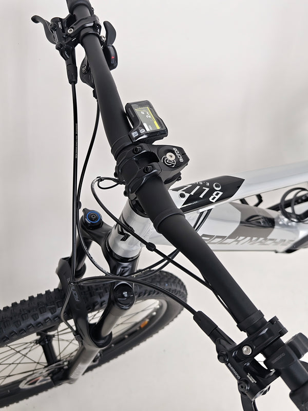 The distinctive branding of RockMachine Blizz e60-29 Electric Mountain Bike with large frame size, RRP: £3,499.00, only 2 miles ridden.