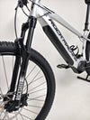 Close-up of the Rock Machine Blizz e60-29 Electric Mountain Bike featuring Rockshox suspension and sleek design.