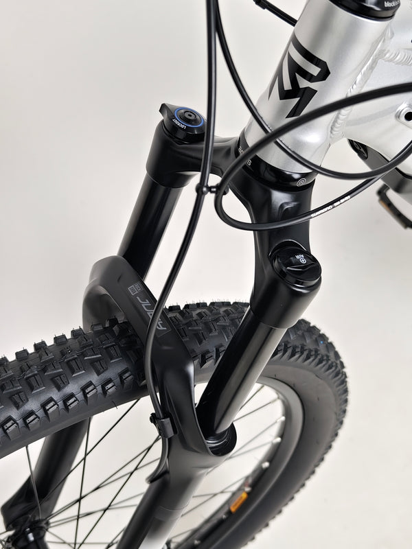 Side view of the RockMachine Blizz e60-29 Electric Mountain Bike with a focus on its tires, LARGE size, RRP: £3,499.00, only 2 miles used.