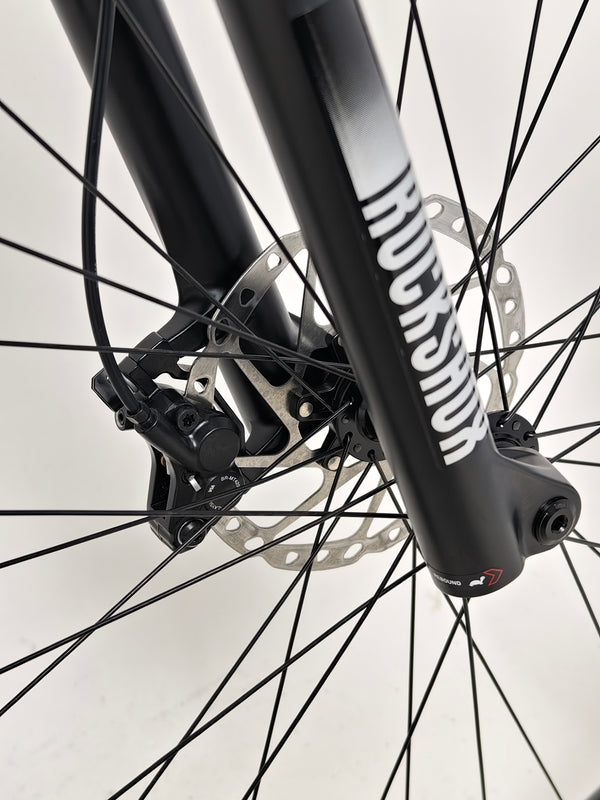 Rear view of RockMachine Blizz e60-29 Electric Mountain Bike capturing details of the seat and frame, LARGE size, RRP: £3,499.00, only 2 miles ridden.