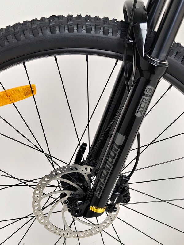 Image of the front fork and brake assembly on GT Zaskar FS Sport 2024 for detailed performance review.