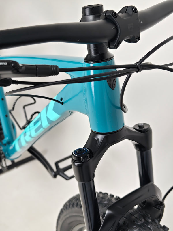 Professional shot of Trek ROSCOE 7 2021 bike showcasing suspension and wheel setup, XL frame, available for £590.