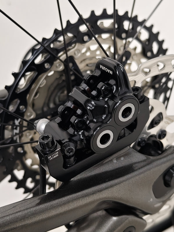 Bike set against a scenic backdrop highlighting the Rocky Mountain Altitude Carbon 70 2022, offered at £2,590.00 with free UK delivery.