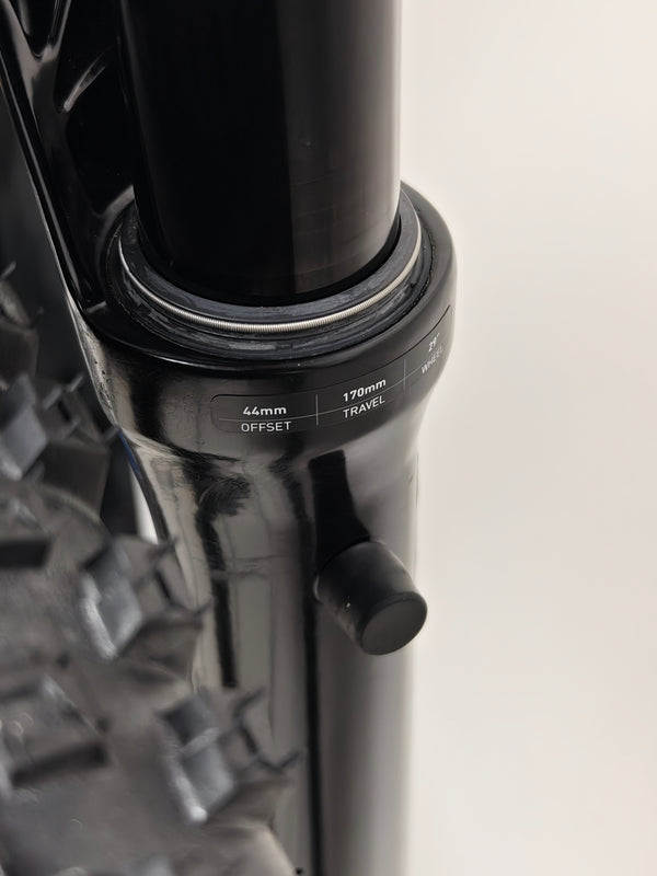 Image of the Rocky Mountain Altitude Carbon 70 2022 bike with cycling gear in a natural setting to emphasize outdoor use for £2,590.00 with free UK delivery.