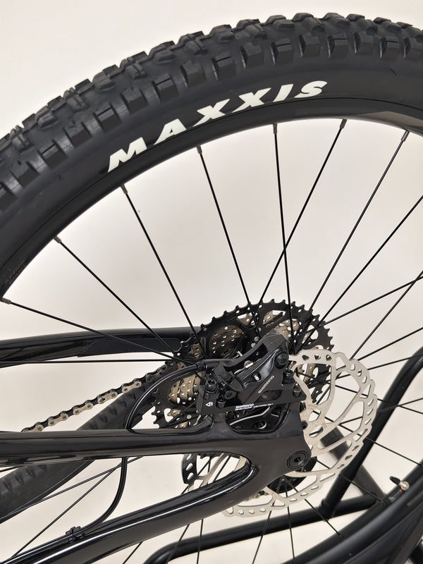 Giant Reign Advanced Pro 2 29 Carbon bike standing prominently on a rocky outcrop, showcasing stability and quality, in Very Good Condition, LARGE size, RRP £4,499.00, now just £1,790.00!