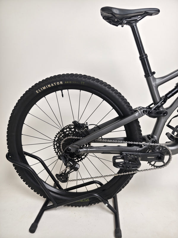 Specialized Stumpjumper EVO Comp Alloy 29 Medium S3 positioned against a forest backdrop.