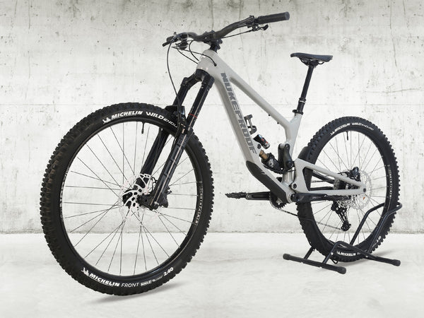 Close-up view of the Nukeproof Giga 290 Comp Carbon 2022 logo and design on the frame.