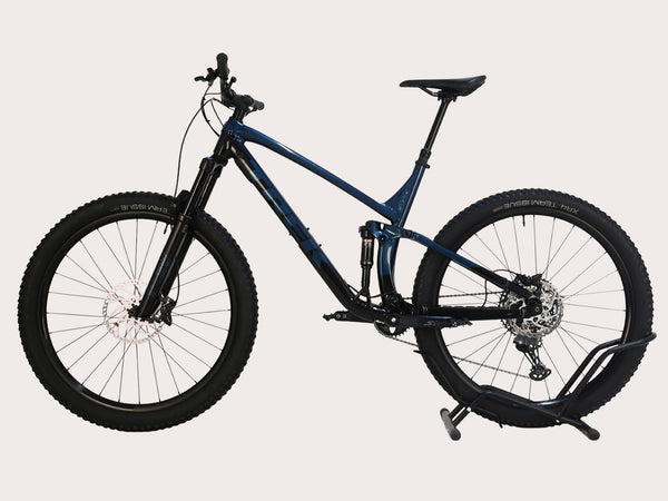 Close-up view of Trek Fuel EX 8 XT 2022's Shimano Deore XT 12-speed shifters, showcasing high-quality components.